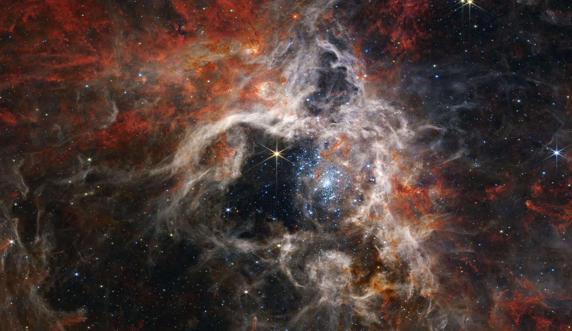 La région de formation stellaire massive 30 Doradus dans le Grand Nuage de Magellan.